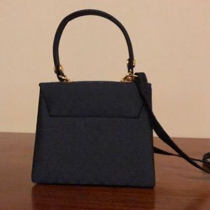 Jim Thompson navy blue silk mini bag.